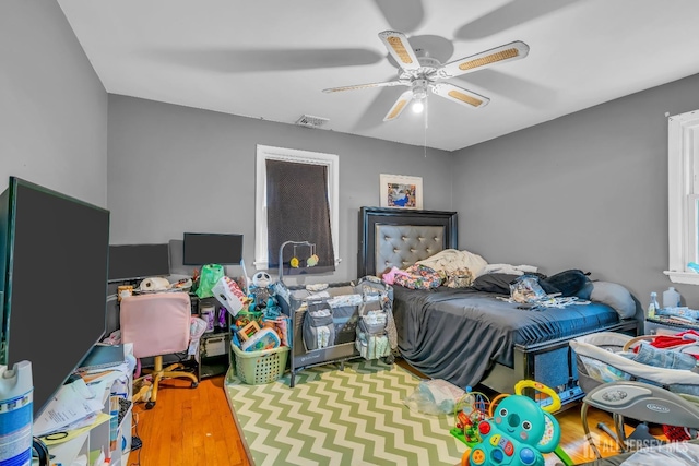 bedroom featuring hardwood / wood-style flooring and ceiling fan