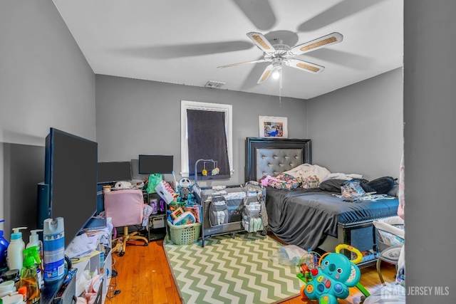 bedroom featuring ceiling fan and wood-type flooring