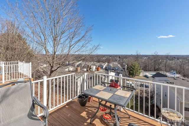 wooden terrace featuring a residential view