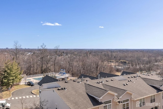 drone / aerial view with a view of trees