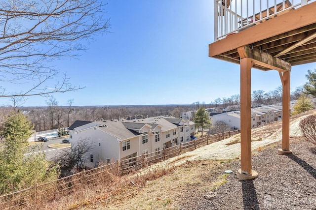 exterior space with fence and a residential view