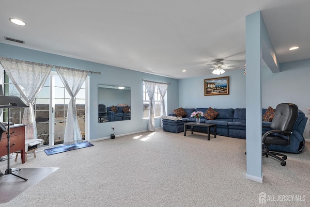 living room featuring recessed lighting, carpet flooring, baseboards, and visible vents