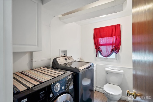 217 Fred Allen Dr, South Plainfield, NJ 07080 - laundry area featuring independent washer and dryer, wainscoting, tile walls, and wood finished floors