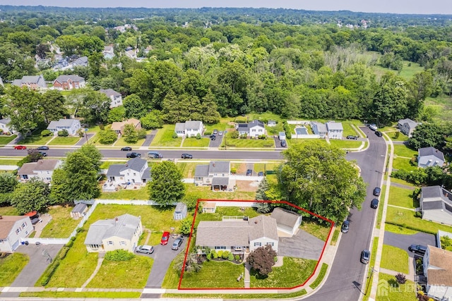 217 Fred Allen Dr, South Plainfield, NJ 07080 - aerial view of residential area with property boundaries highlighted and a heavily wooded area
