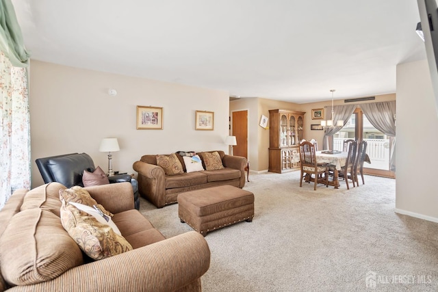 217 Fred Allen Dr, South Plainfield, NJ 07080 - living area featuring light colored carpet and a chandelier