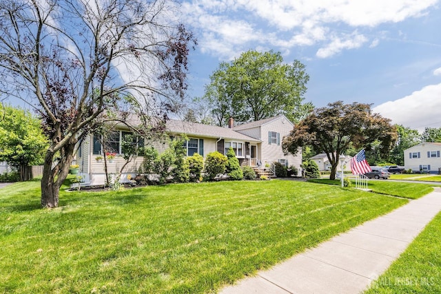 217 Fred Allen Dr, South Plainfield, NJ 07080 - tri-level home featuring a chimney and a front yard