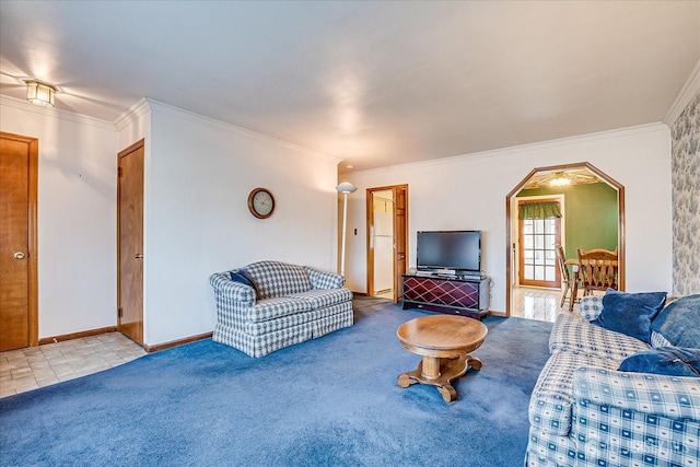 carpeted living area featuring arched walkways, baseboards, and ornamental molding