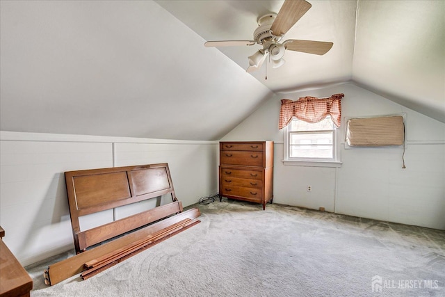 bonus room with vaulted ceiling, carpet, and a ceiling fan