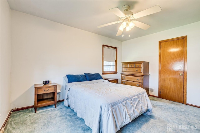 bedroom with baseboards, light colored carpet, and ceiling fan