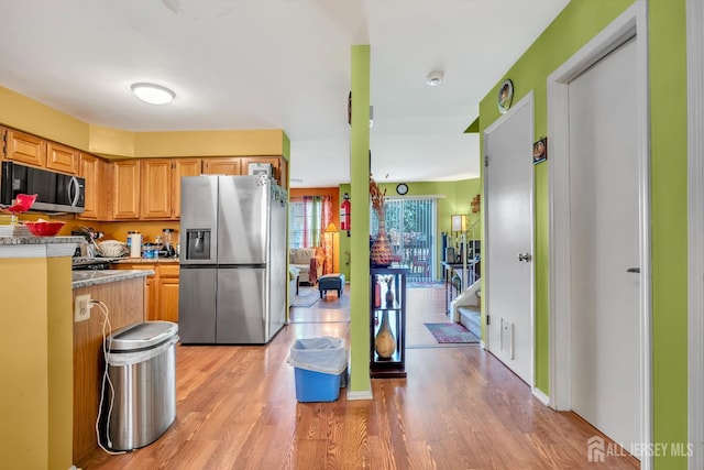 122 Salem Rd, North Brunswick, NJ 08902 - kitchen with stainless steel appliances, light wood-style flooring, and light countertops