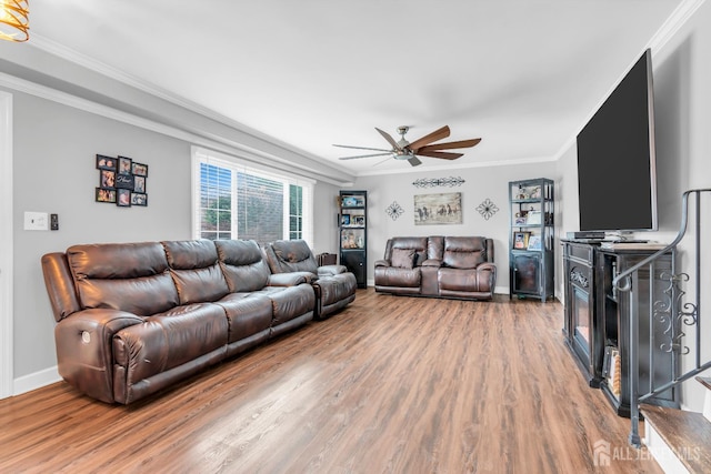 14 E Shirley Ave, Colonia, NJ 07067 - living room featuring wood finished floors, crown molding, and a ceiling fan