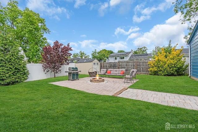 14 E Shirley Ave, Colonia, NJ 07067 - fenced backyard featuring a shed, a patio, and an outdoor fire pit
