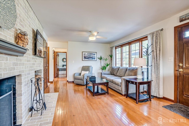 27 Vermont Ave, Franklin, NJ 08823 - living room featuring light wood-type flooring, a fireplace, and a ceiling fan