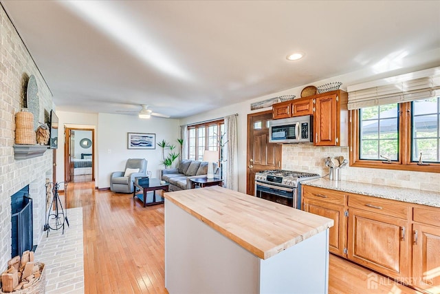 27 Vermont Ave, Franklin, NJ 08823 - kitchen featuring stainless steel appliances, wood counters, plenty of natural light, a kitchen island, and recessed lighting