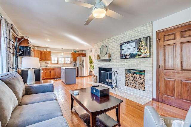 27 Vermont Ave, Franklin, NJ 08823 - living area featuring a brick fireplace, light wood finished floors, ceiling fan, and recessed lighting