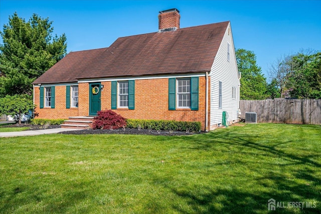 27 Vermont Ave, Franklin, NJ 08823 - view of front of home with a chimney, brick siding, and roof with shingles