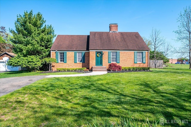 27 Vermont Ave, Franklin, NJ 08823 - view of front of property with a chimney, a front yard, and brick siding