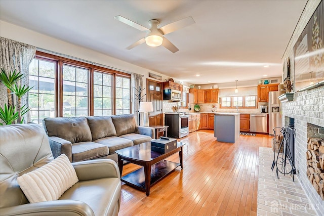27 Vermont Ave, Franklin, NJ 08823 - living room with a ceiling fan, light wood-style flooring, a fireplace, and recessed lighting