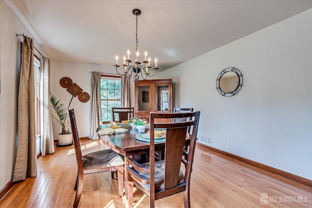 27 Vermont Ave, Franklin, NJ 08823 - dining room featuring light wood-style flooring and a chandelier