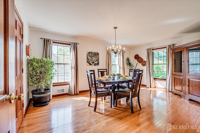 27 Vermont Ave, Franklin, NJ 08823 - dining space featuring a chandelier and light wood finished floors