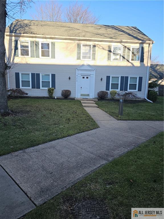 view of front of home with a front lawn