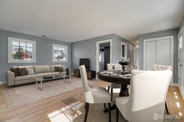 dining room with light hardwood / wood-style flooring