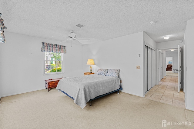 714 Victoria Ct Unit B, Monroe, NJ 08831 - bedroom featuring light colored carpet, a textured ceiling, ceiling fan, baseboards, and a closet