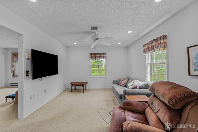 714 Victoria Ct Unit B, Monroe, NJ 08831 - living area featuring a textured ceiling, recessed lighting, light carpet, a ceiling fan, and a baseboard heating unit