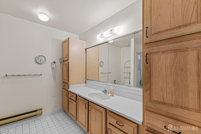 714 Victoria Ct Unit B, Monroe, NJ 08831 - bathroom featuring baseboard heating, vanity, tile patterned floors, and baseboards