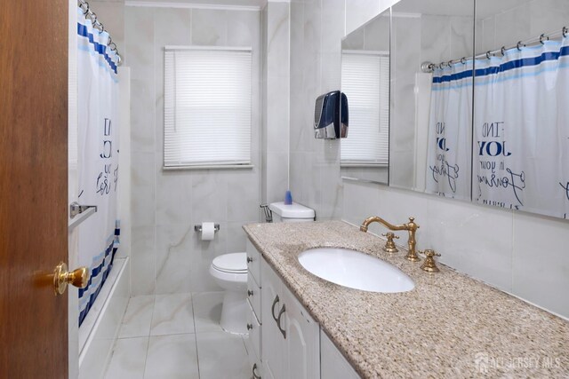 full bathroom with toilet, tile walls, vanity, shower / bathtub combination with curtain, and tile patterned flooring