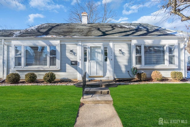 view of front of home with a front yard