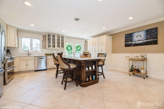 35 Winthrop Dr, Manalapan, NJ 07726 - dining space with crown molding, a wainscoted wall, healthy amount of natural light, recessed lighting, and light tile patterned floors