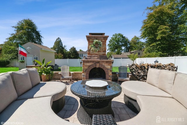 35 Winthrop Dr, Manalapan, NJ 07726 - fenced backyard featuring an outdoor living space with a fireplace and a patio area