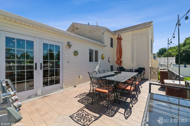 35 Winthrop Dr, Manalapan, NJ 07726 - view of patio / terrace featuring french doors and outdoor dining area
