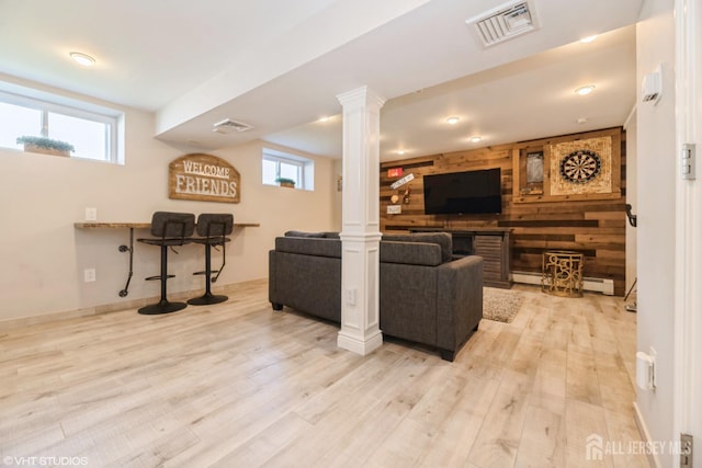 35 Winthrop Dr, Manalapan, NJ 07726 - living area with wood finished floors, plenty of natural light, wood walls, ornate columns, and baseboards