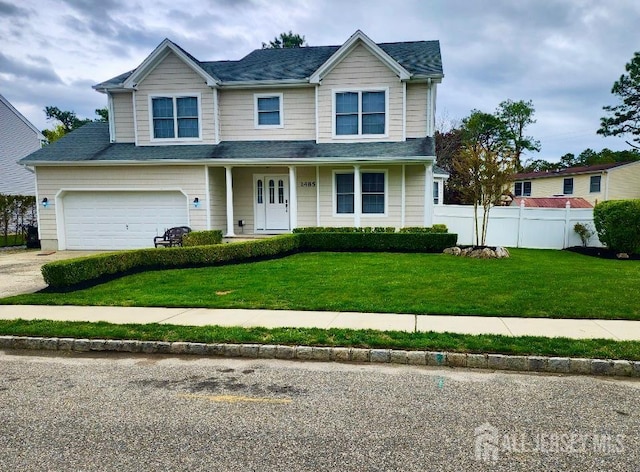 1485 Earie Way, Lacey, NJ 08731 - view of front of property featuring concrete driveway, an attached garage, covered porch, and roof with shingles