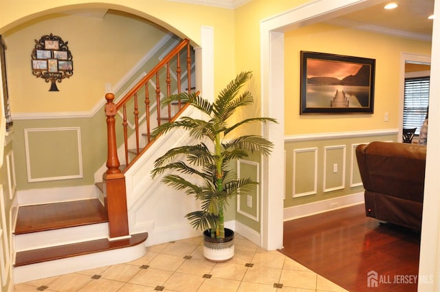 195-195 Wachung Ter, Scotch Plains, NJ 07076 - interior space featuring a decorative wall, a wainscoted wall, crown molding, tile patterned flooring, and arched walkways