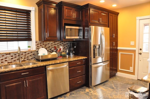 195-195 Wachung Ter, Scotch Plains, NJ 07076 - kitchen featuring appliances with stainless steel finishes, a sink, backsplash, stone counters, and a wainscoted wall