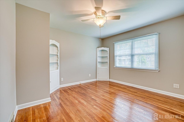 202 Garden Dr, South Plainfield, NJ 07080 - empty room featuring light wood-style floors, a ceiling fan, and baseboards