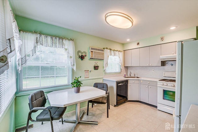 202 Garden Dr, South Plainfield, NJ 07080 - kitchen featuring white appliances, ventilation hood, a sink, light countertops, and a wall mounted AC
