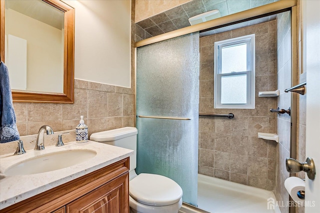 202 Garden Dr, South Plainfield, NJ 07080 - full bathroom featuring toilet, a stall shower, vanity, and tile walls