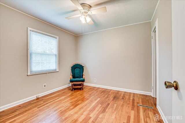 202 Garden Dr, South Plainfield, NJ 07080 - unfurnished room featuring crown molding, ceiling fan, wood finished floors, and baseboards