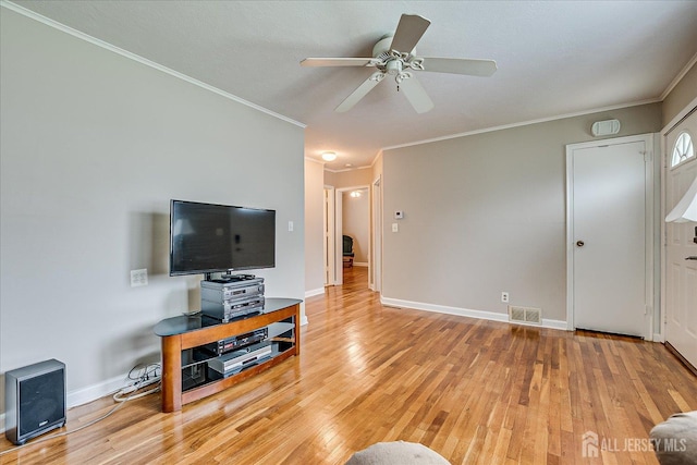 202 Garden Dr, South Plainfield, NJ 07080 - living room with light wood finished floors, ornamental molding, a ceiling fan, and baseboards