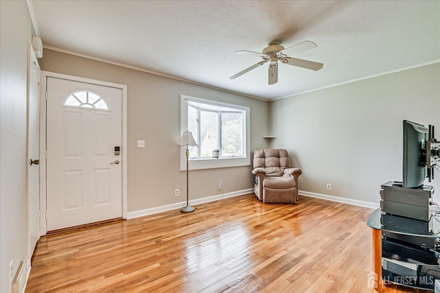 202 Garden Dr, South Plainfield, NJ 07080 - foyer entrance with ceiling fan, light wood-type flooring, crown molding, and baseboards