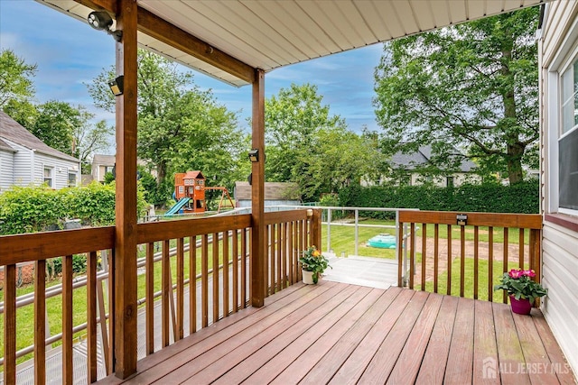202 Garden Dr, South Plainfield, NJ 07080 - wooden terrace with a yard and a playground
