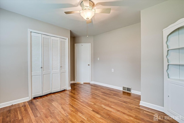 202 Garden Dr, South Plainfield, NJ 07080 - unfurnished bedroom featuring light wood-style floors, a closet, baseboards, and a ceiling fan