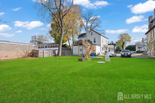 view of yard with a wooden deck