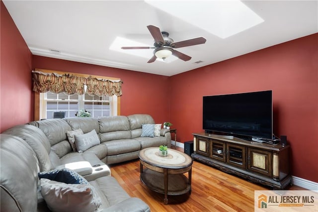 49 Lavender Dr, Edison, NJ 08820 - living area featuring wood finished floors, ceiling fan, and a skylight