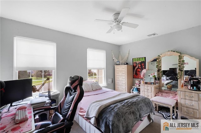 49 Lavender Dr, Edison, NJ 08820 - carpeted bedroom with a desk and ceiling fan