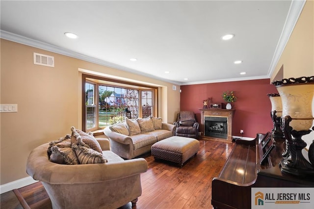 49 Lavender Dr, Edison, NJ 08820 - living room with recessed lighting, ornamental molding, a fireplace, and wood-type flooring